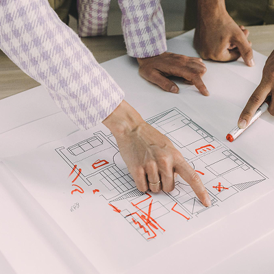 hands pointing to a map